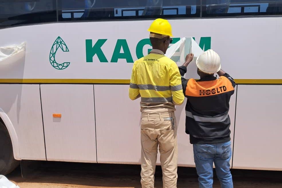 House of Cafeda crew branding a KAGEM Mining bus